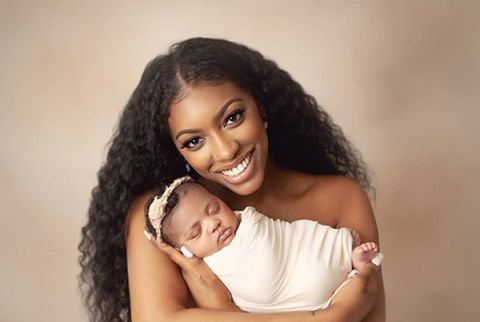 Porsha Williams of the Real Housewives of Atlanta, holding her newborn baby, Pilar Jhena