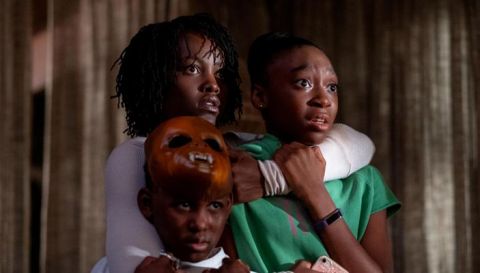 Lupita Nyong’o as Adelaide Wilson, in the movie Us, directed by Jordan Peele, holds onto her two children played by Shahadi Wright Joseph and Evan Alex.  