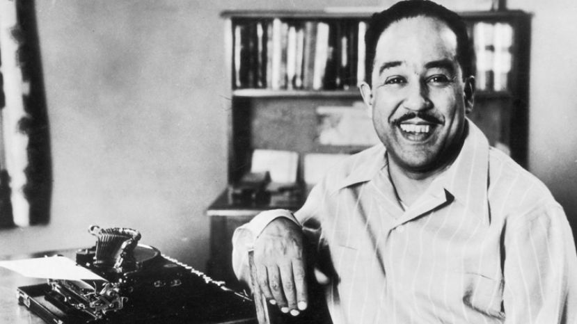 American poet, novelist, and playwirght, Langston Hughes at work on his typewriter
