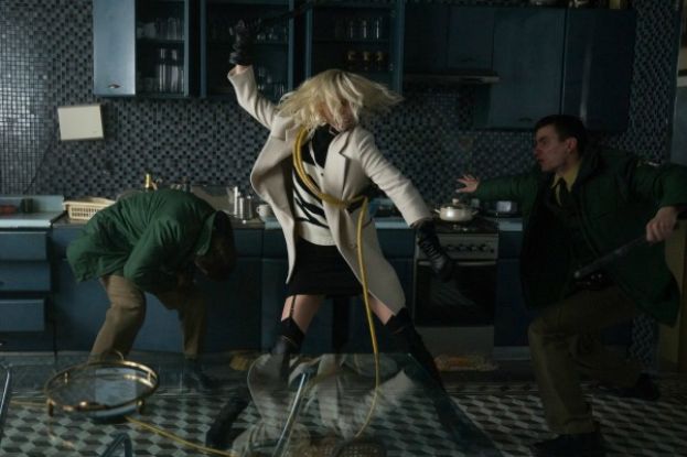 Charlize Theron (center) fighting off assailants in the movie, Atomic Blonde. 