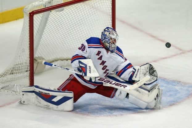 New York Rangers goalie Henrik Lundqvist doing his usual defensive acrobatics 