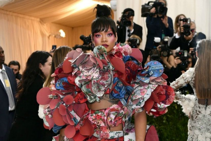 Rihanna on the red carpet at the 2017 Met Gala in a Comme de Garcons look