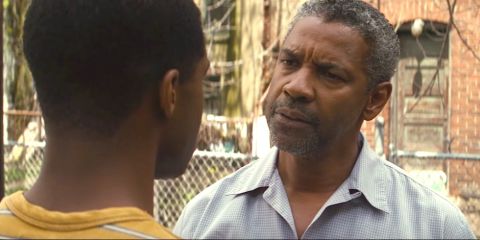 Actor Denzel Washington talking with his son in the movie, Fences.