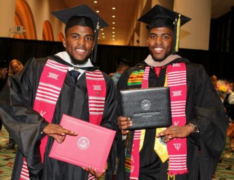 Freddie Perry and his twin brother graduating with Master's Degrees