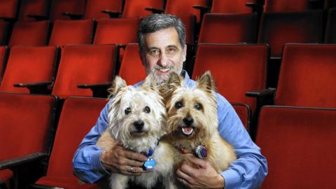 Two dogs that play the role of Toto in The Wiz Live! with their trainer, Bill Berloni