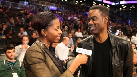 What's The 411Sports correspondent Crystal Lynn talking with actor/comedian Chris Rock during halftime at a 2013 Brooklyn Nets vs. Miami Heat game