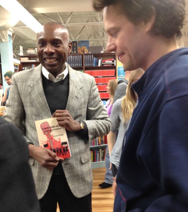 Carl Unegbu, author of Comedy Under Attack, talking with audience members at Book Culture
