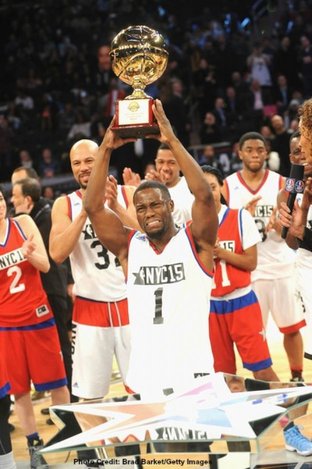 Comedian Kevin Hart holding his fourth NBA All-Star Celebrity Game MVP Award