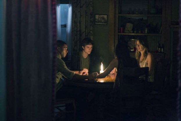 Photo From left to right: Lucien Laviscount, Douglas Smith, Cressida Bonas, and Jenna Kanell, the cast of The Bye, Bye Man at a séance.